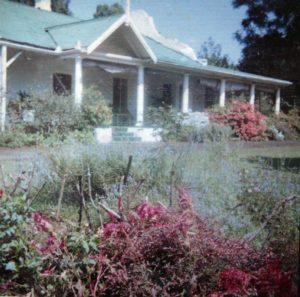 house with flowers in yard